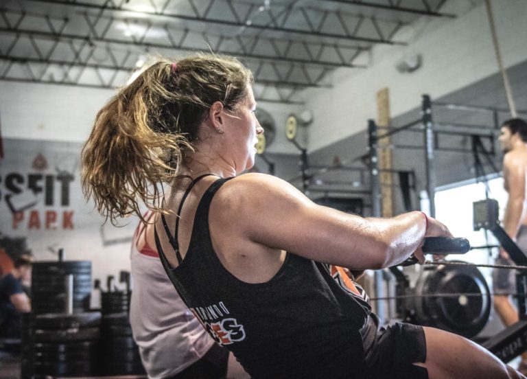 Photo shows woman with light colored hair working out.
