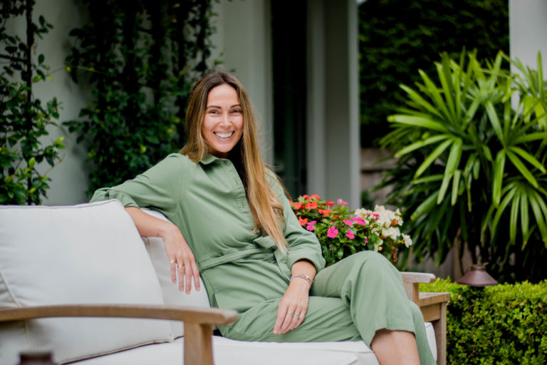 Jamie Gernert seated in her courtyard.