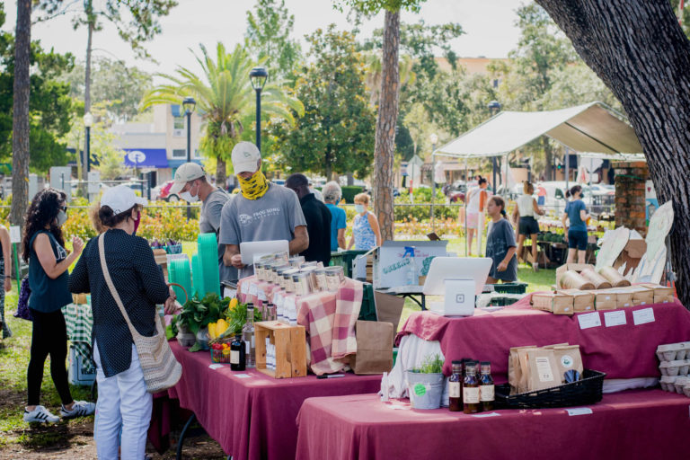 Woman peruses produce at Winter Park Farmers' Market.